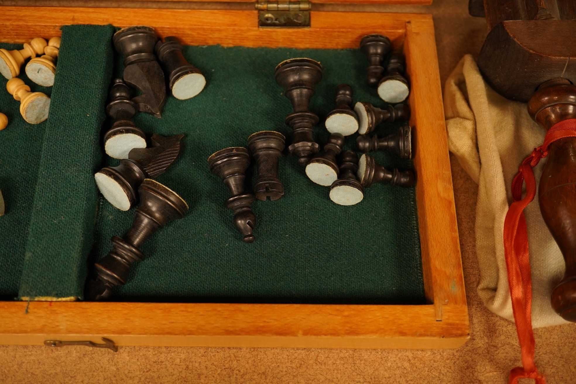 Two boxed chess sets, a cricket ball and a bird scaring rattle, largest chess set 32cm wide x 9cm high x 20cm deep.